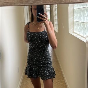 Floral sundress with adjustable tie straps.